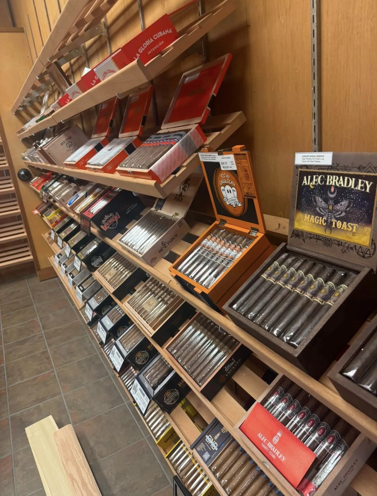 Premium cigars displayed in the Empire Stogie Lounge humidor